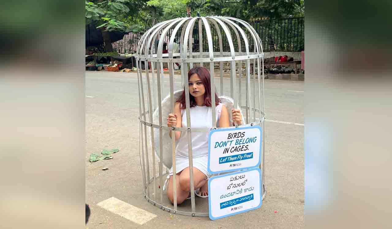 PETA India supporter transforms into caged bird in Hyderabad, calls for freedom