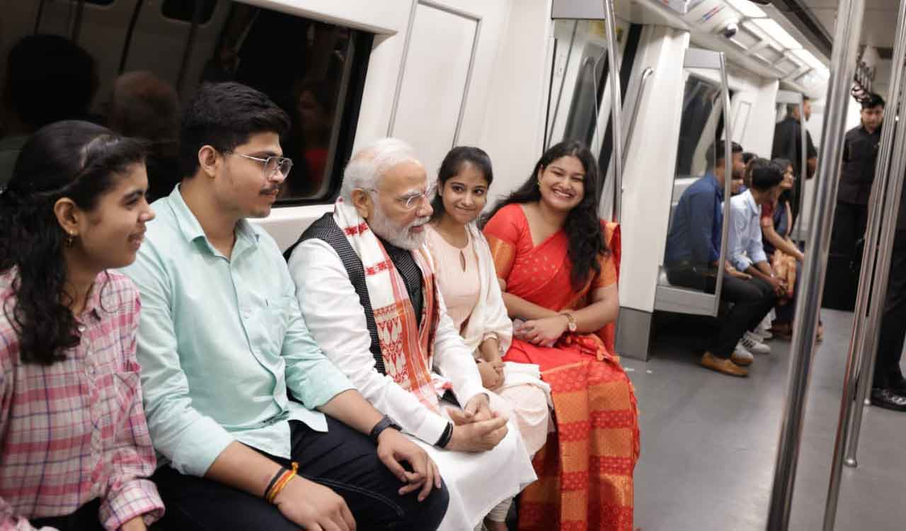PM Modi interacts with youngsters in metro on his way to Delhi University