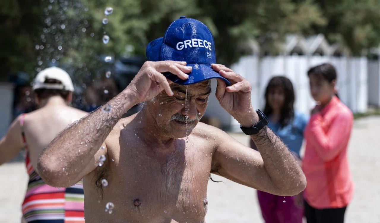 People and pets seek shade and cool as Europe sizzles under heat wave