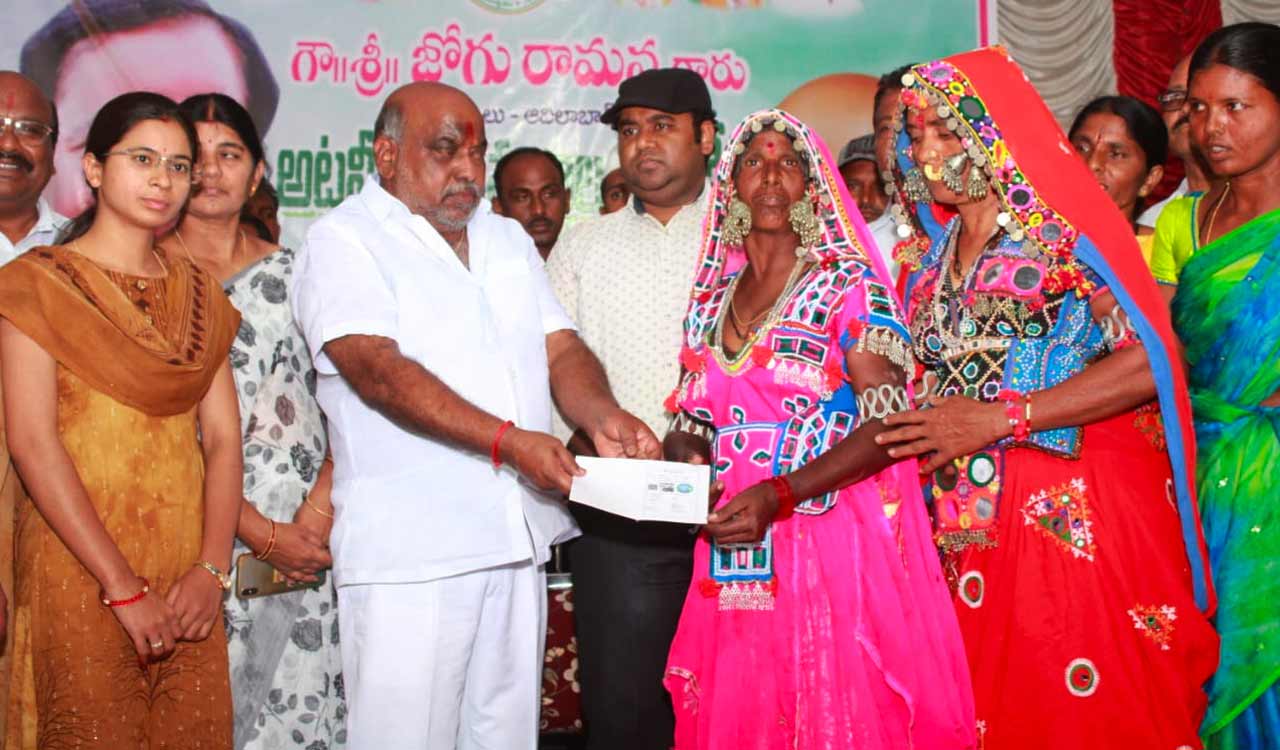 MLA Jogu Ramanna hands over podu land pattas to 4,017 tribals in Adilabad