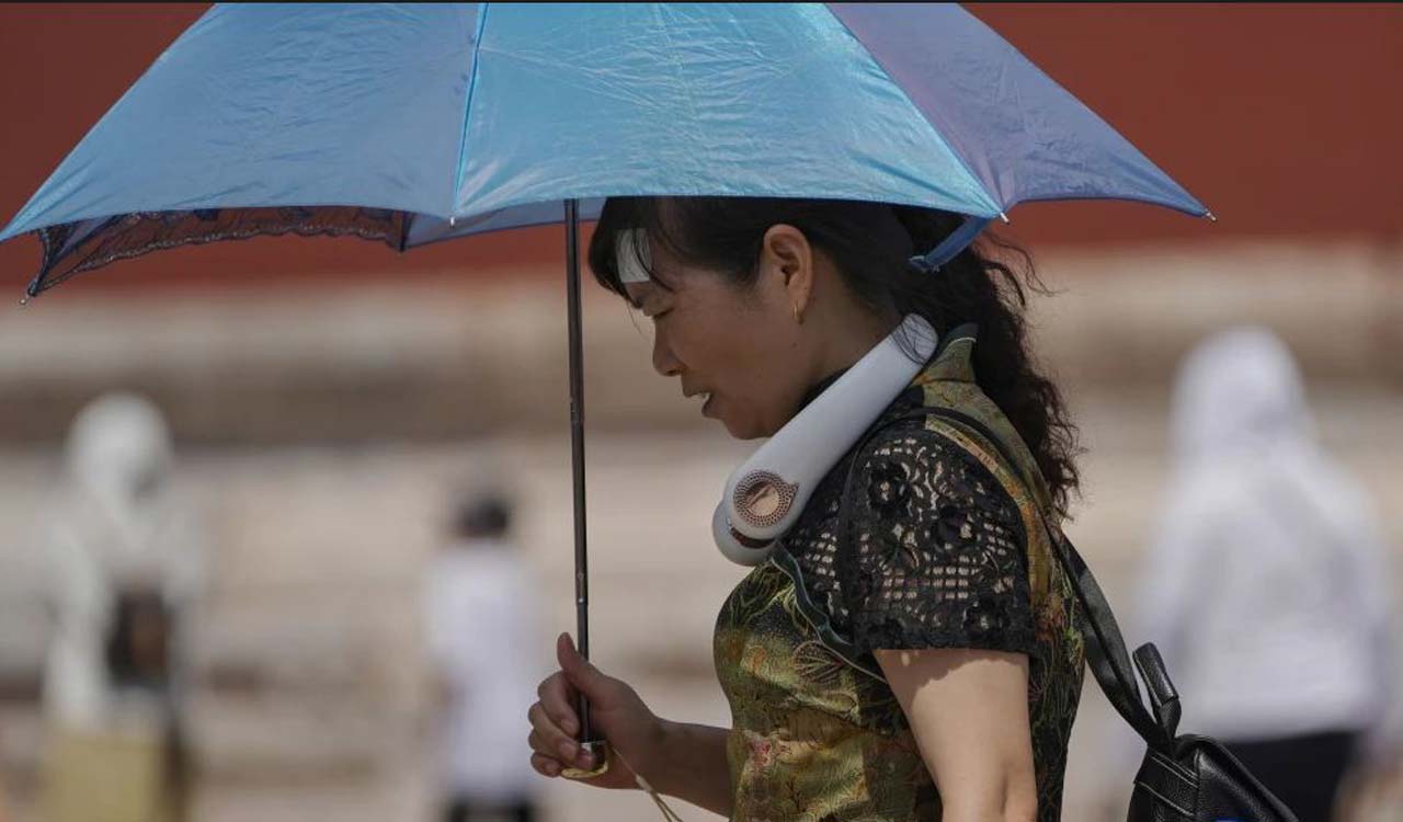 9 missing in China landslide sparked by heavy rains amid flooding and searing temperatures