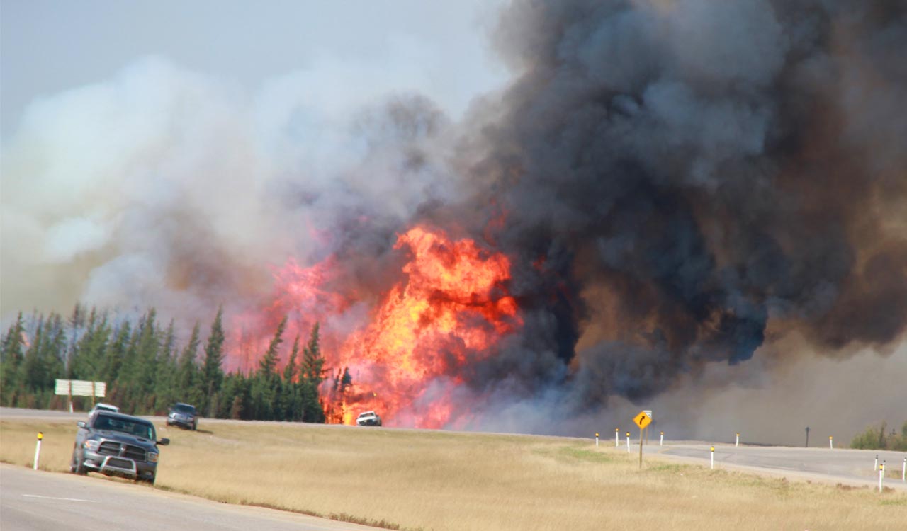 Wildfires prompt evacuation orders for 30,000 households in Canadian province