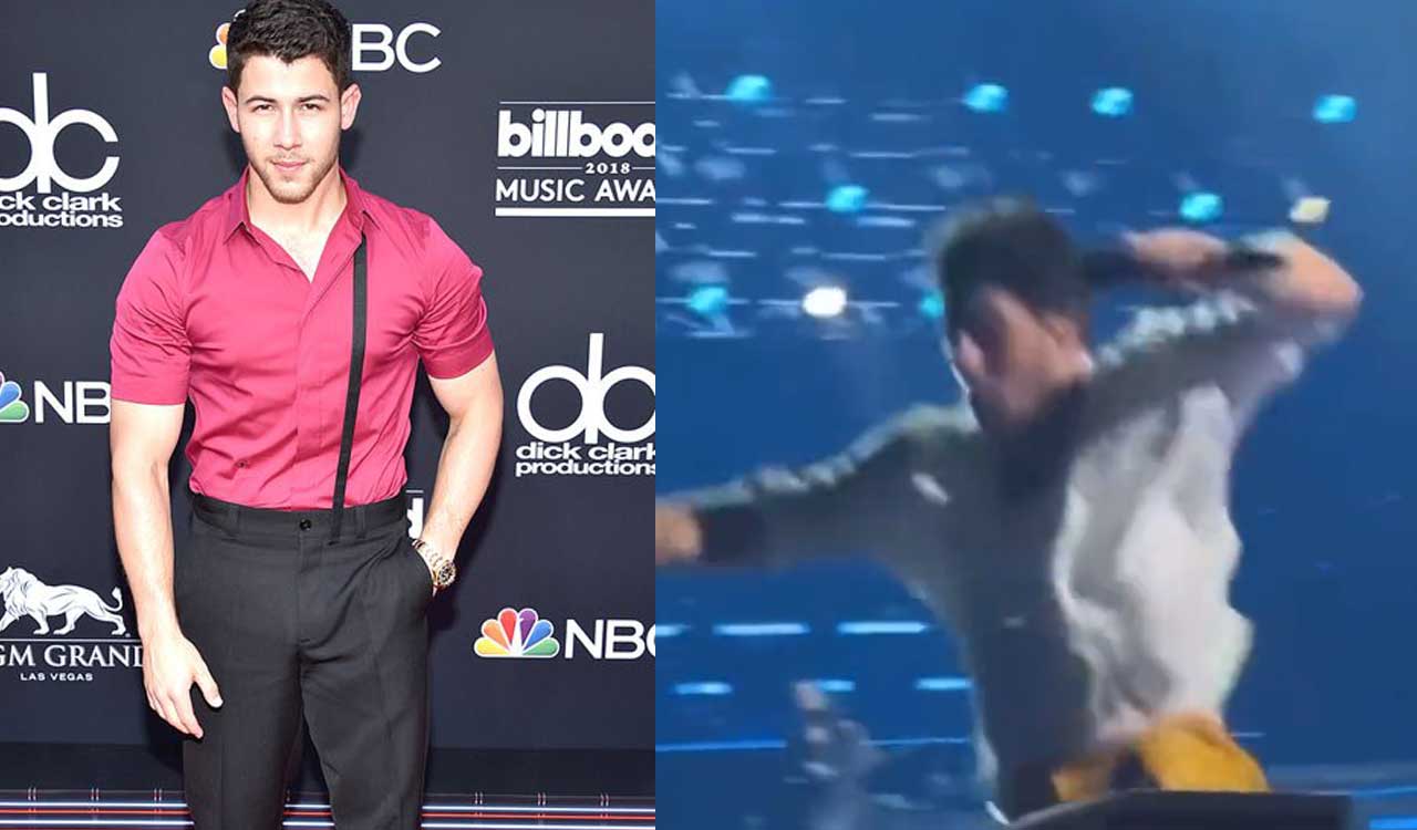 Nick Jonas caught on camera falling through a hole on stage