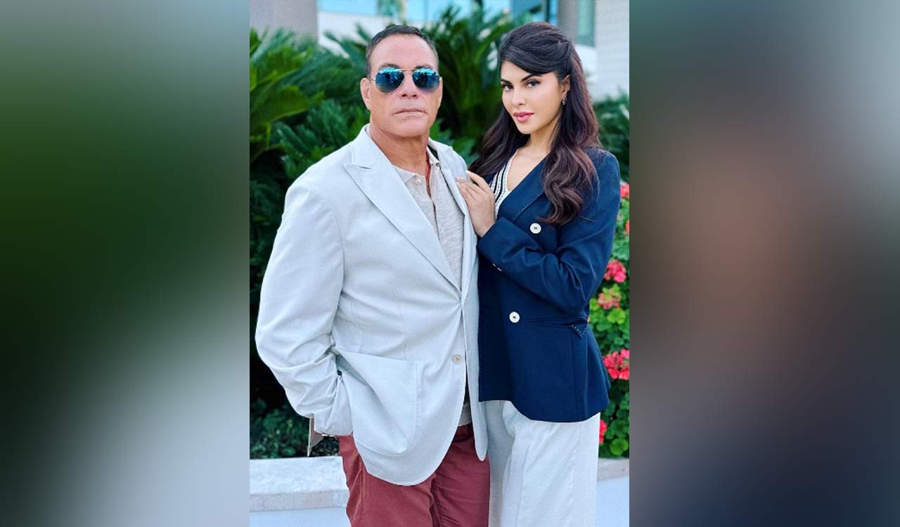 Jacqueline Fernandez poses with action atar Jean-Claude Van Damme in Italy