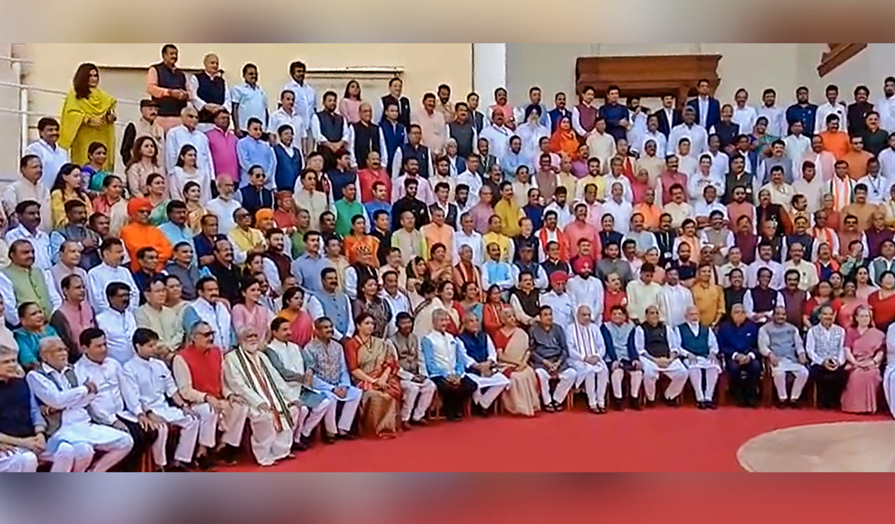 MPs gather for group photo ahead of Parliament session in new building