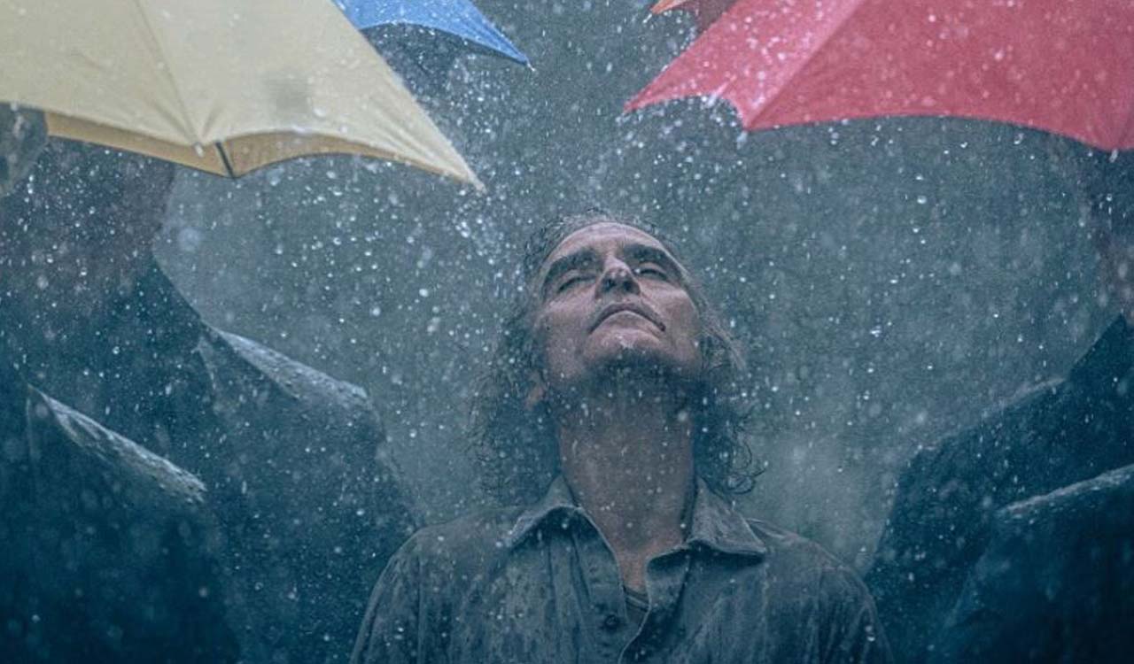 Joaquin Phoenix is dancing in the rain in new ‘Joker 2’ image