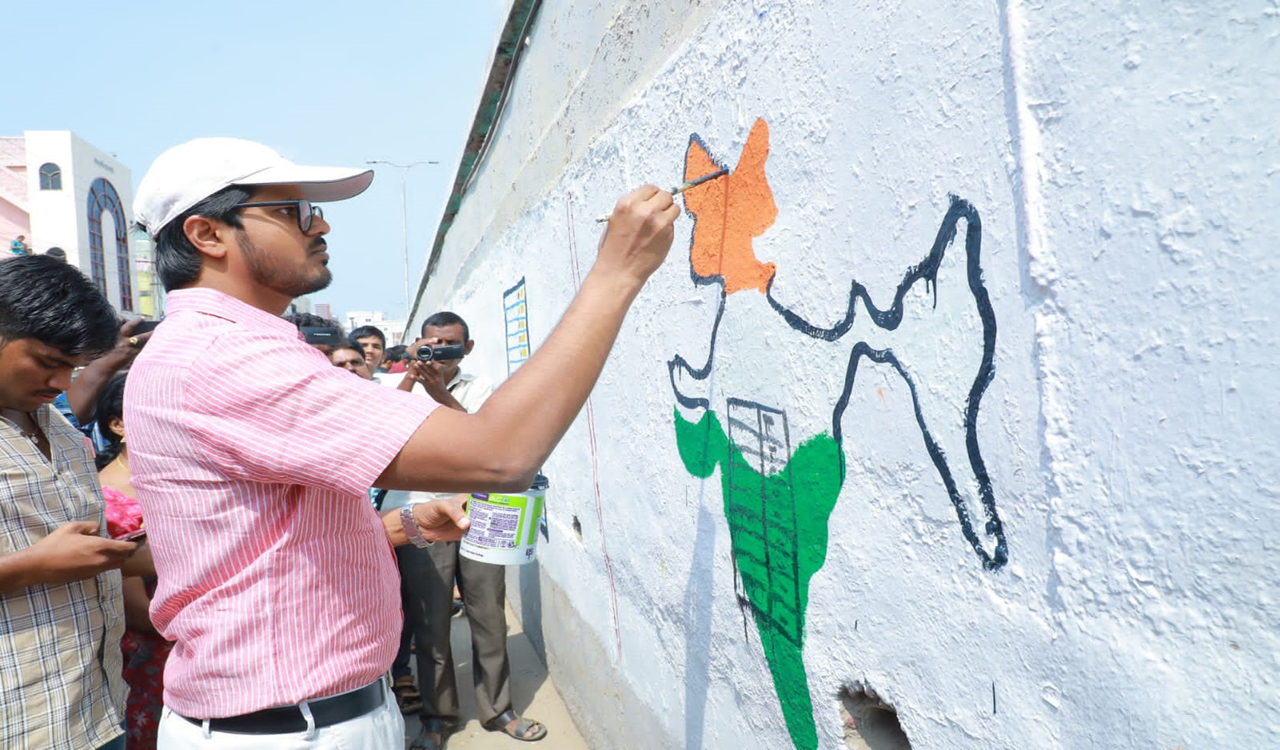Collector Gautham takes part in SVEEP activity draws wall paintings in Madhira