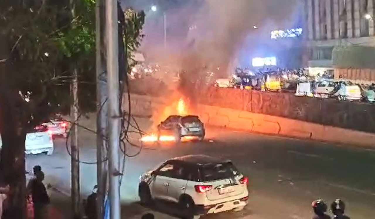 Watch: Car catches fire in Hyderabad, traffic flow affected on ...