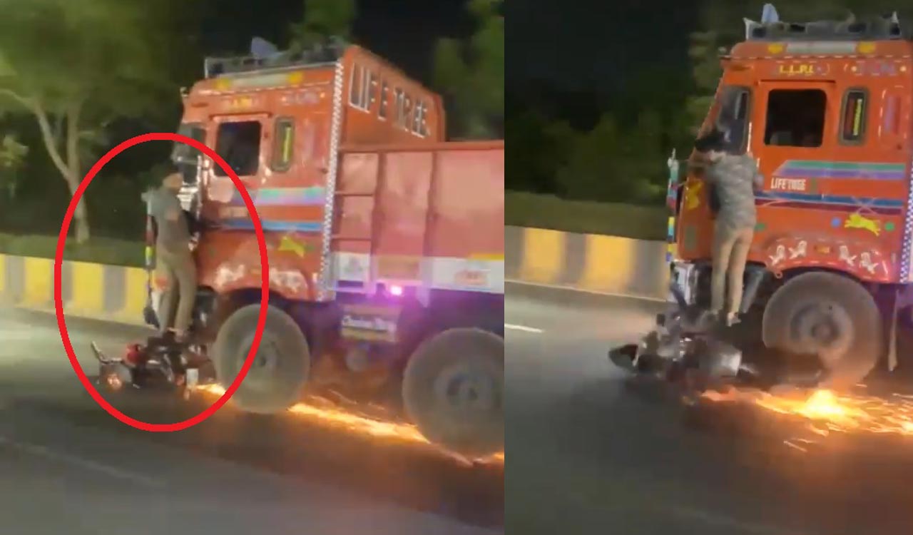 Watch: Man clings to speeding truck as bike dragged in Hyderabad