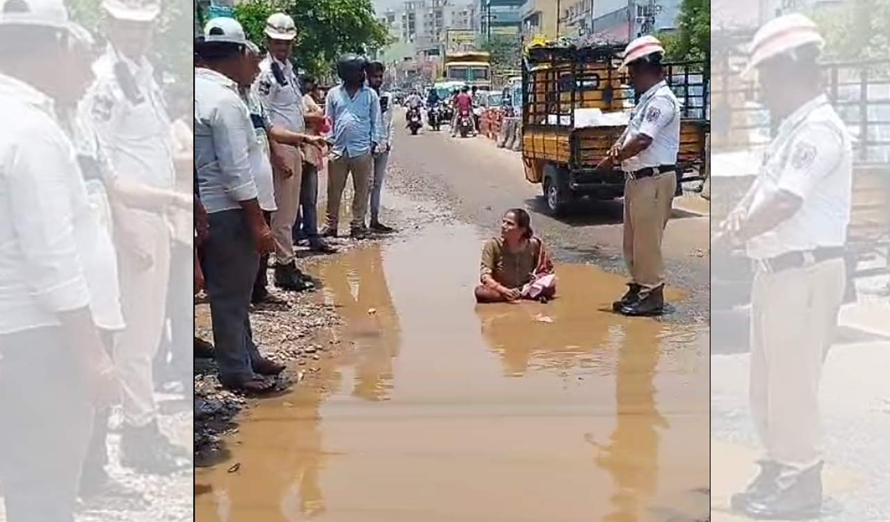 Watch: Woman protests bad roads in Hyderabad by sitting in water-filled pothole at Nagole