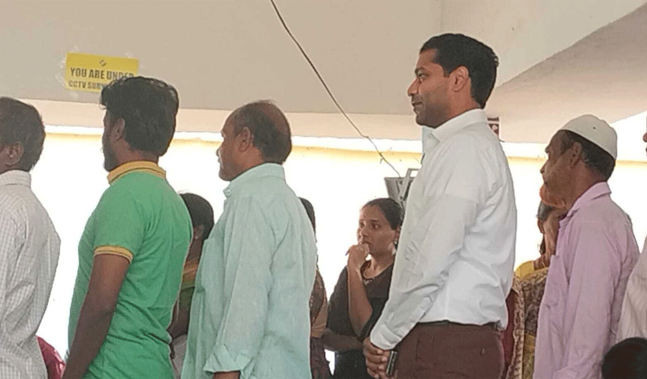 Peddapalli Collector stands in queue to vote