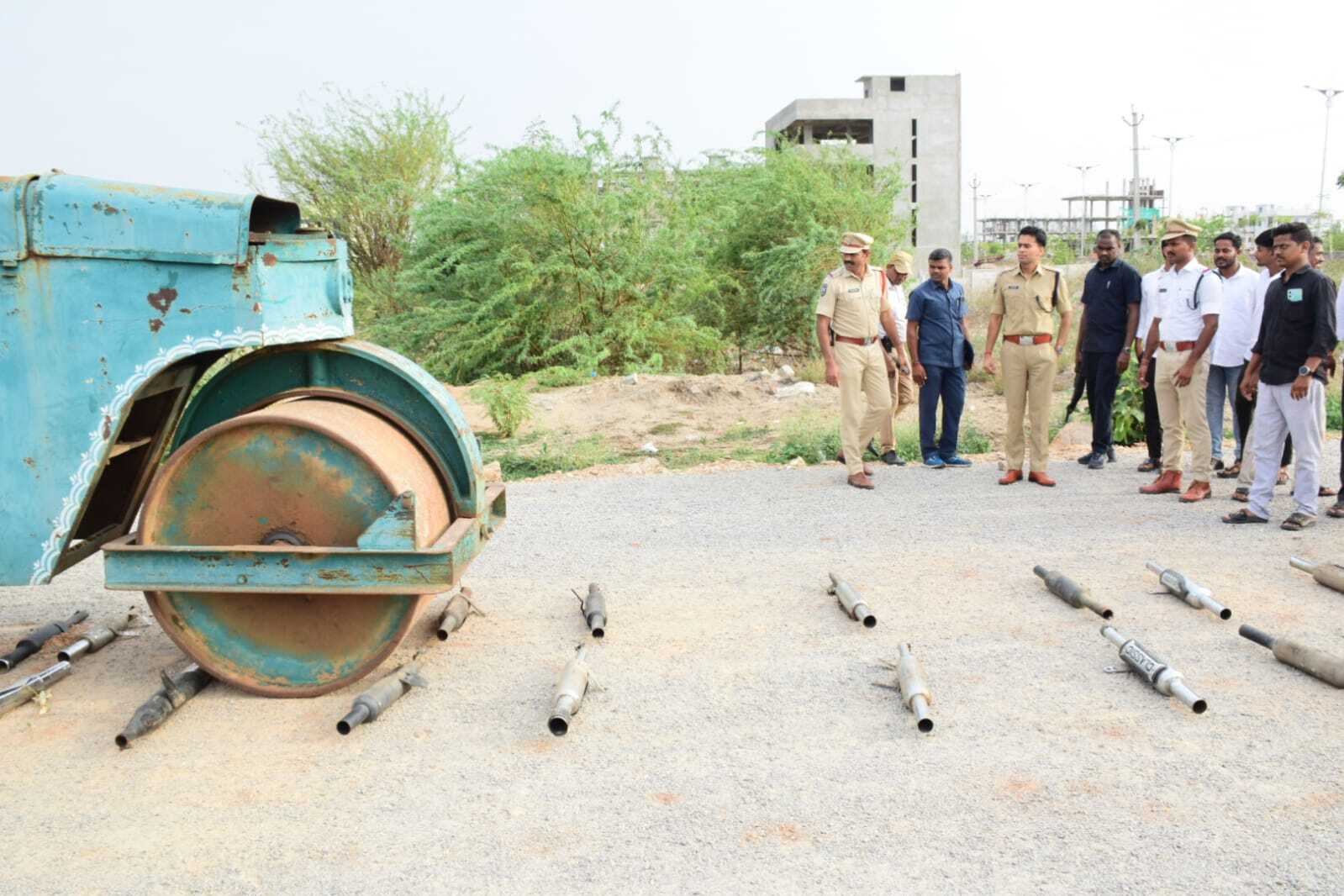 Sircilla police crush modified silencers with road roller