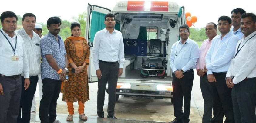 Collector M Manu Chowdary is accepting ALS ambulance from ICICI staff in Siddipet on Saturday.