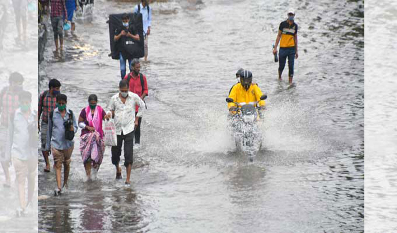 Heavy rains pound Mumbai, road cave-in hits traffic on Ahmedabad highway