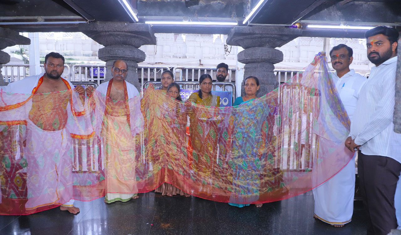 Sircilla weaver presents saree in matchbox to Vemulawada temple