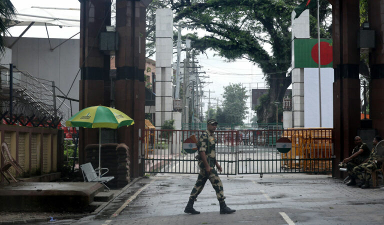 An BSF officer patrols at Petrapole-Benapole Border between India and Bangladesh. — Photo: PTI