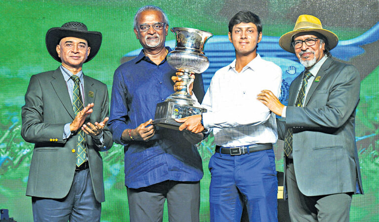 Golfer Vishesh Sharma with winners trophy in Hyderabad.
