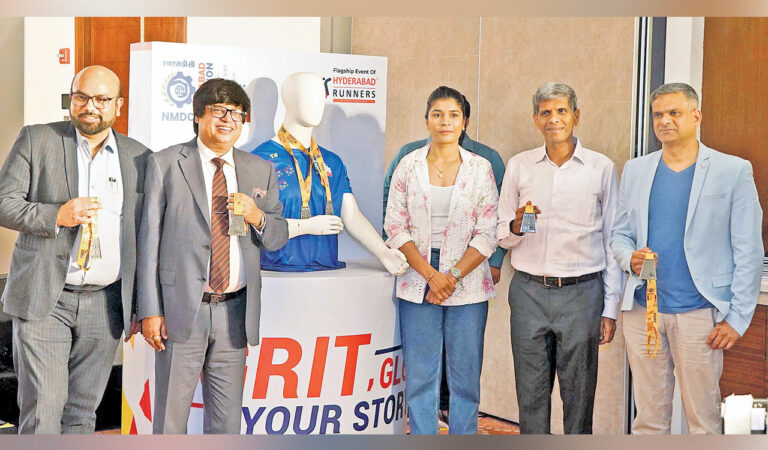 Rajesh Vetcha (2nd right) and Nikhat Zareen (middle) at the T-Shirt launch event of the Hyderabad Marathon on Tuesday.