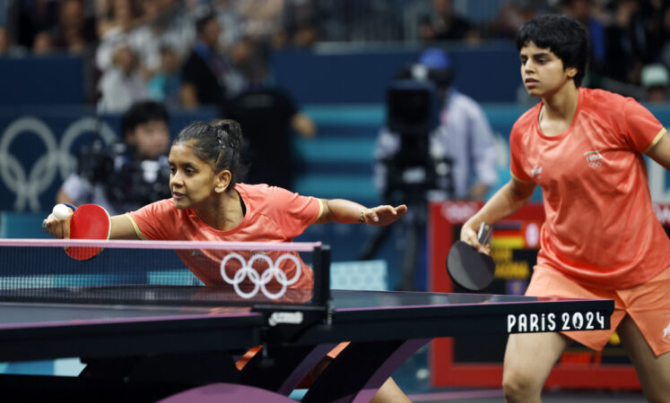 Sreeja Akula (L) and Archana Girish Kamath of India in action against Yuan Wan and Shan Xiaona of Germany during the Womens Team Quarterfinal Game between India and Germany at the Table Tennis competitions in the Paris 2024 Olympic Games, at The South Paris Arena in Paris, France, 07 August 2024.