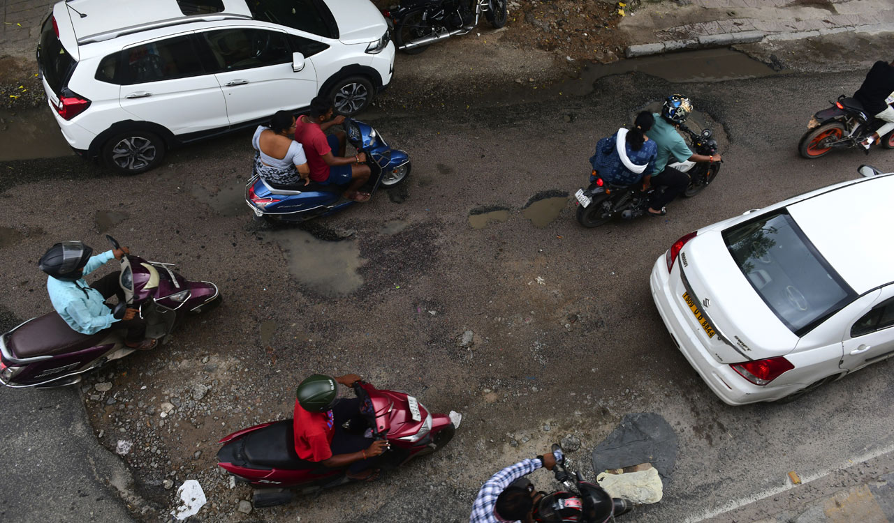 Motorists in Hyderabad struggle to negotiate through roads damaged due to rains