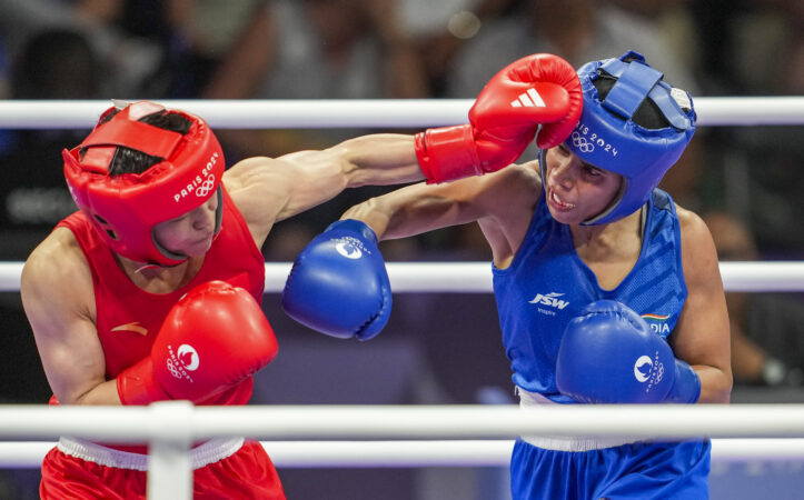 India's Nikhat Zareen (in blue) and Chinas Wu Yu during their womens 50kg Round of 16 boxing match at the 2024 Summer Olympics, in Paris, France, Thursday, Aug. 1, 2024. (PTI Photo/Ravi Choudhary)
