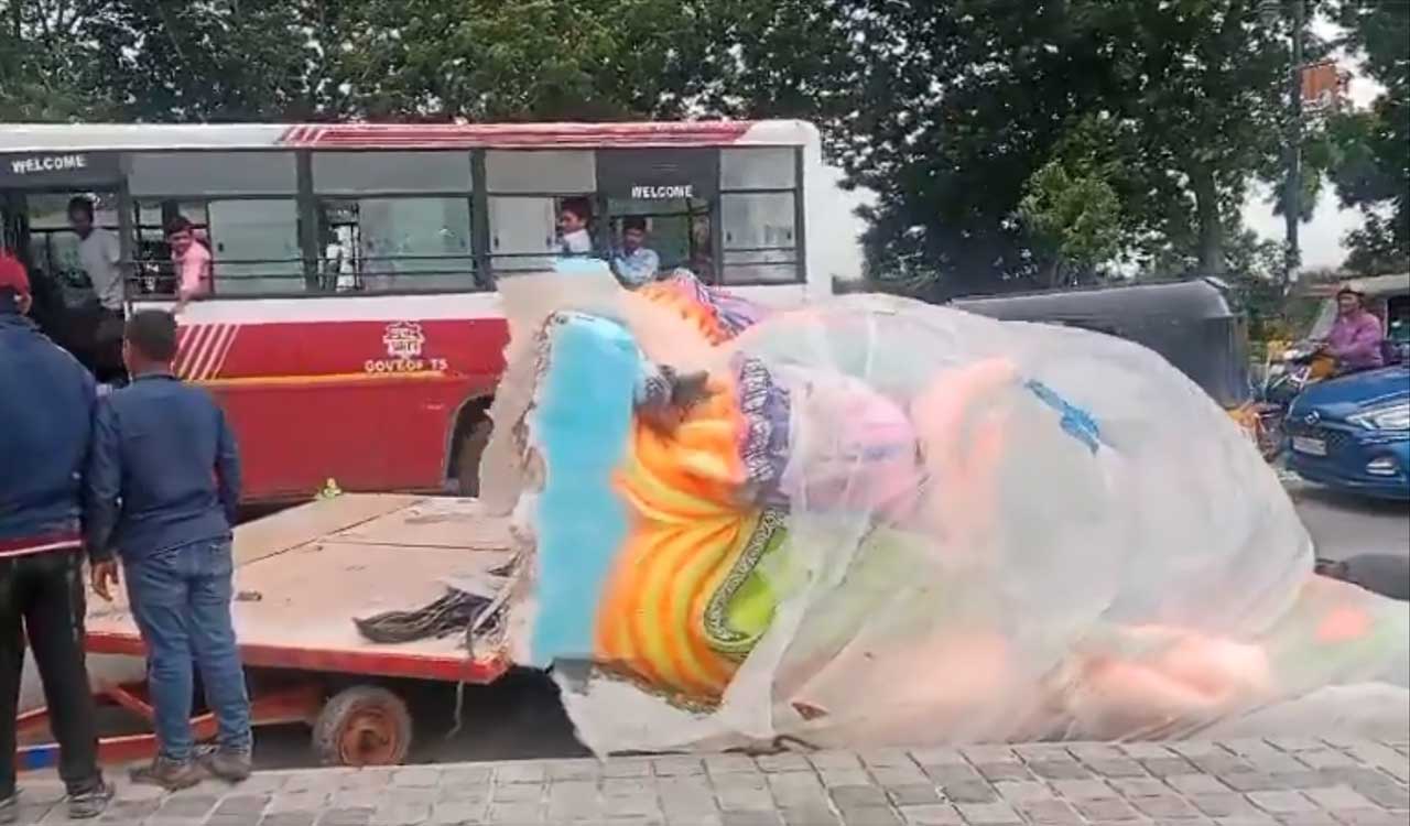 Watch: Traffic halts as Ganesh idol falls off on road at Tank Bund in Hyderabad