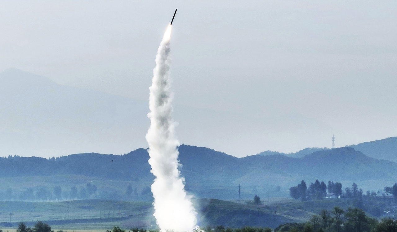 Kim Jong Un oversees tests of 2 missiles, calls for bolstering military