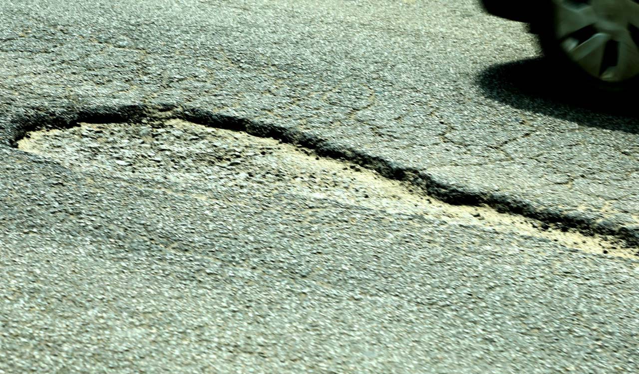 Sangareddy: Potholes make life difficult for road users on NH-65