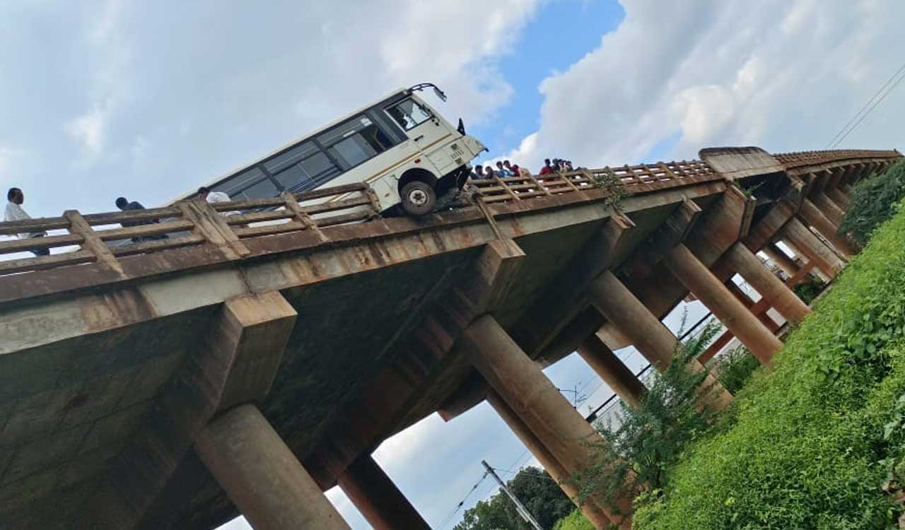 Sangareddy: Driver escapes unhurt after bus rams into railing, hangs off bridge