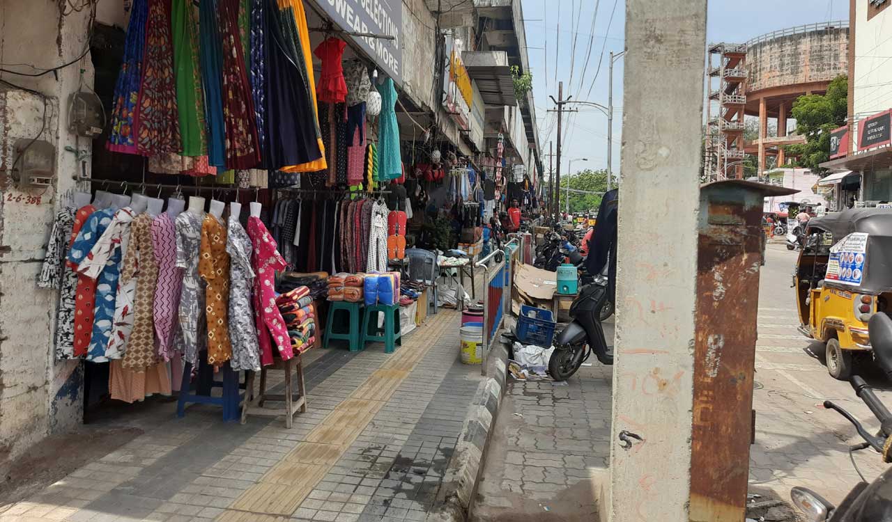 Footpaths encroached by traders causing problem to pedestrians in Karimnagar town