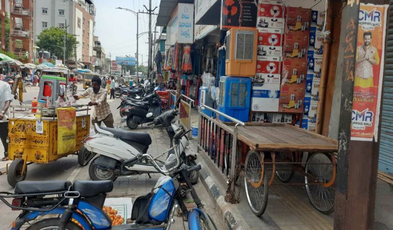 Footpaths encroached by traders causing problem to pedestrians in Karimnagar town