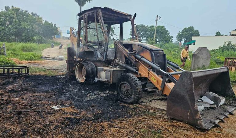 An altercation between two persons escalated to the point where one group demolished a house using a JCB earthmover, while the opposing group retaliated by setting the JCB and a Mahindra Bolero SUV on fire.