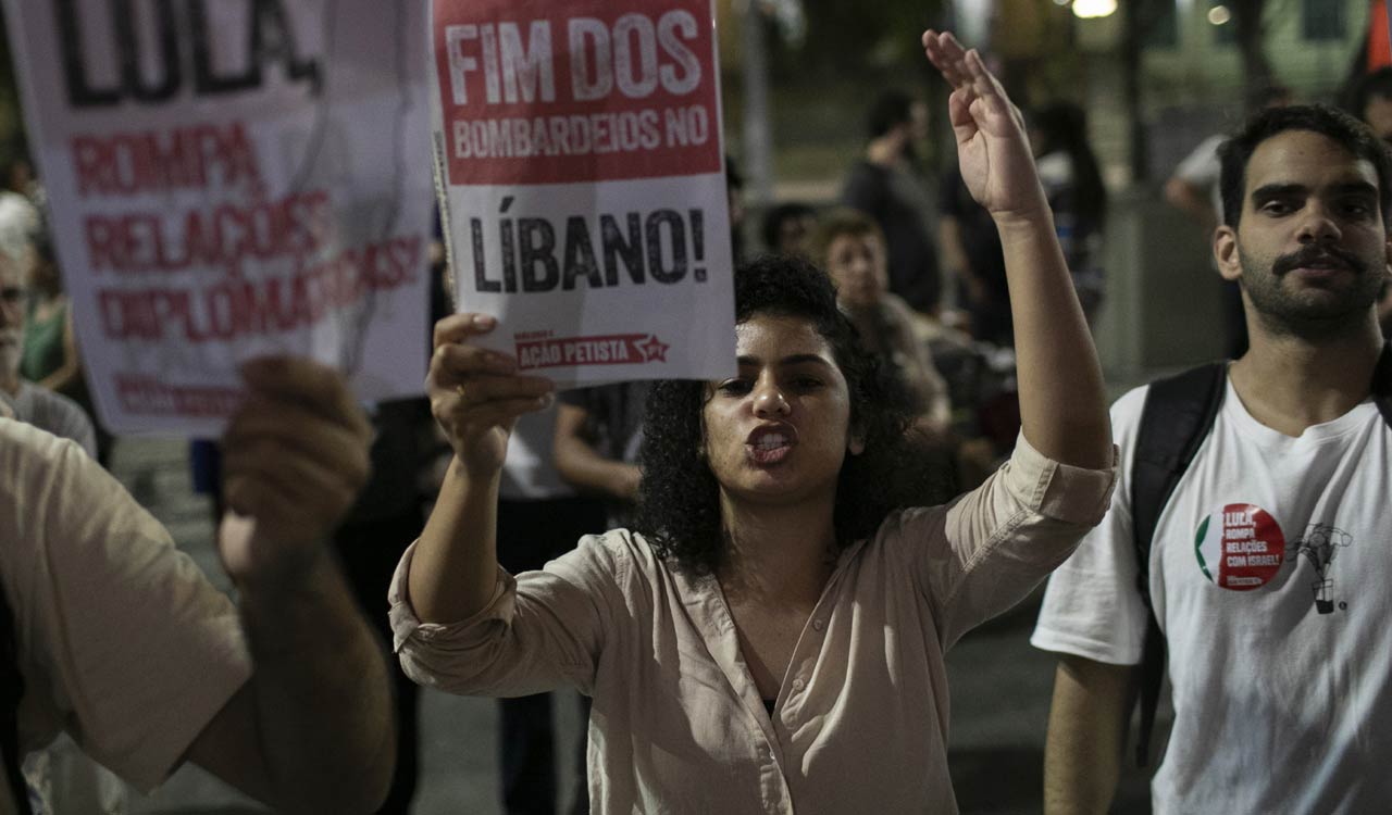 Hezbollah steps up rocket fire, Israel sends more troops into Lebanon