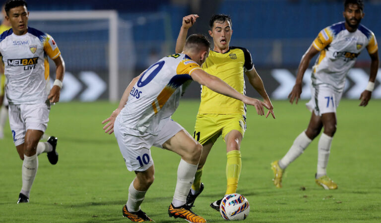 HFC's Cy Goddard (middle) in action during the match in Hyderabad on Tuesday.