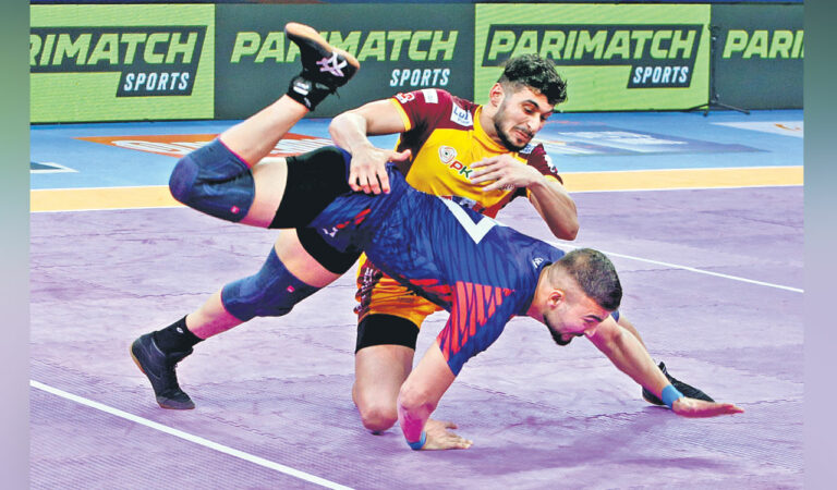 Players of Telugu Titans and Dabang Delhi K.C in action in Hyderabad.