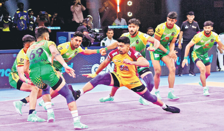 Telugu Titans Pawan Sehrawat (middle) in action against Patna Pirates in Hyderabad on Monday.
