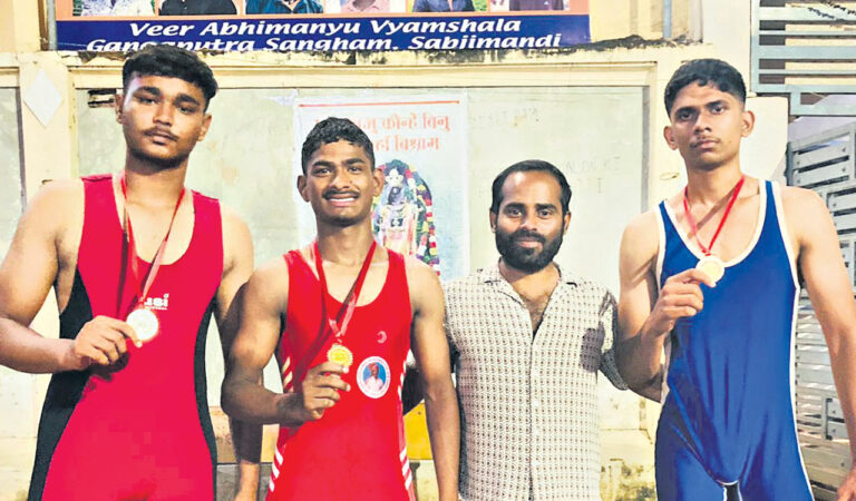 Wrestlers B Santosh Kumar, Uday Kiran, and Laksh with coach C Sandeep Yadav.
