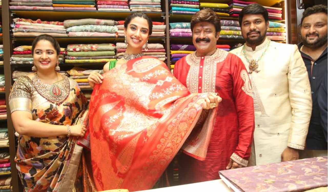 Balakrishna joins Meenakshi Choudhary for Vaarahi Silks launch
