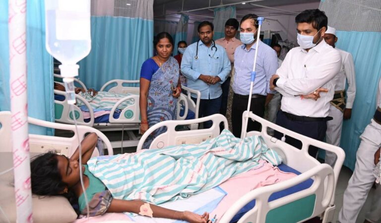Kumram Bheem Asifabad district Collector Venkatesh Dothre and Additional Collector Deepak Tiwari visit a student from an Ashram school of Wankidi mandal centre, undergoing treatment at a private hospital in Mancherial on Wednesday
