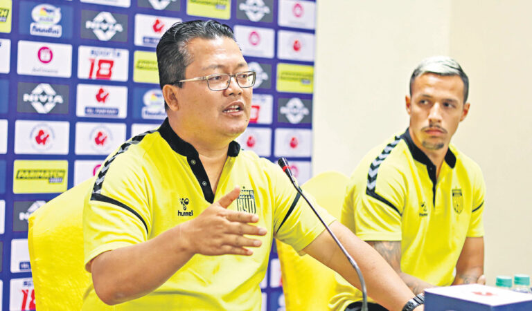 HFC head coach Thangboi Singto (left) and forward Allan Paulista in Hyderabad on Sunday.