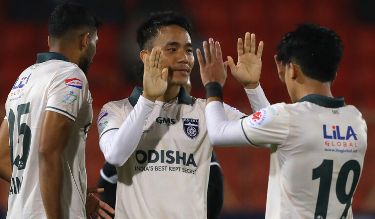 Odisha's Lalthathanga Khawlhring (centre) celebrates with teammates after scoring against HFC in Hyderabad on Monday.