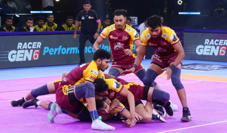 Players of Telugu Titans and Tamil Thalaivas in action.