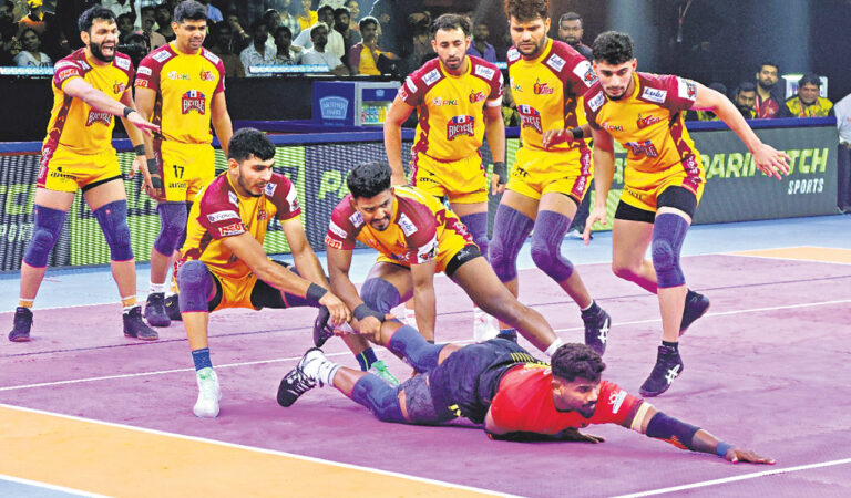 Players of Telugu Titans and Bengaluru Bulls in action on Saturday.