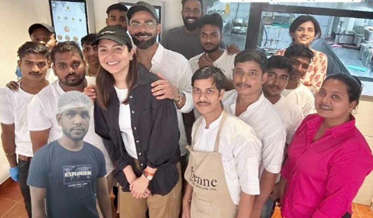 The actress took to her Instagram handle and re-shared a post of a café featuring her and Virat posing with the staff members.