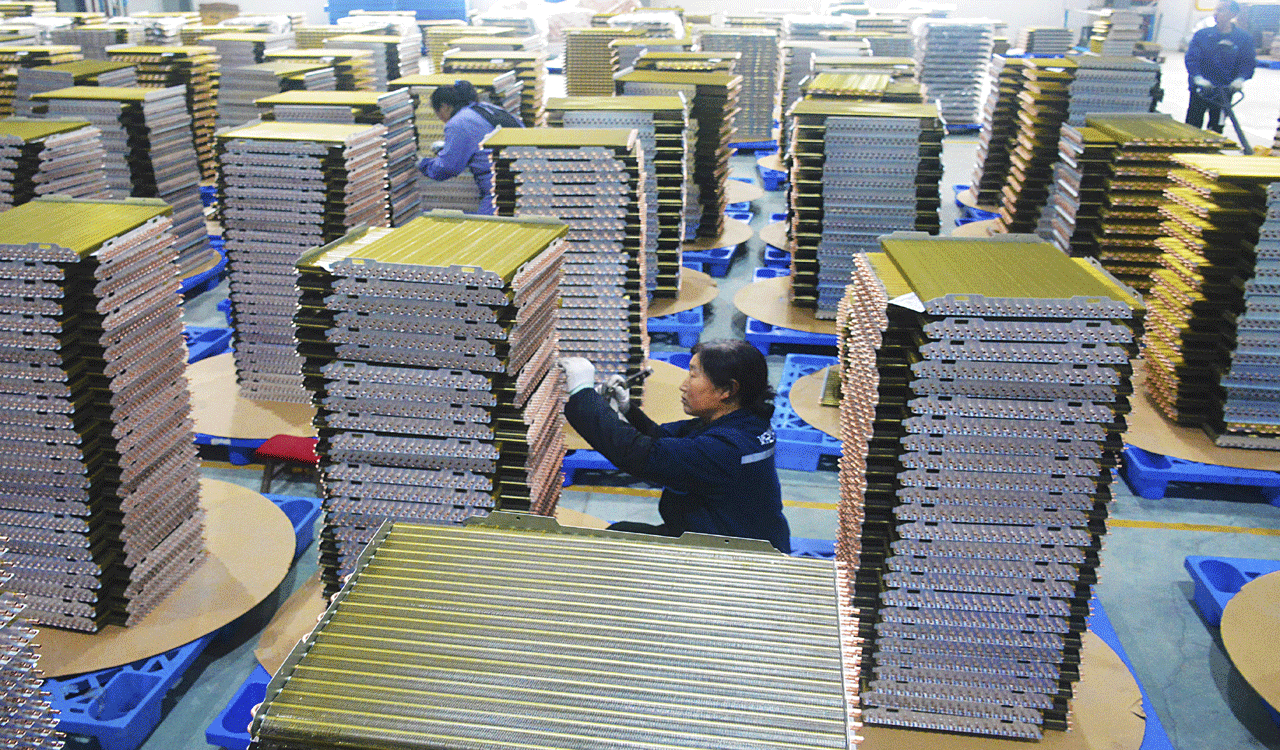 China’s manufacturing expands at slower pace in December
