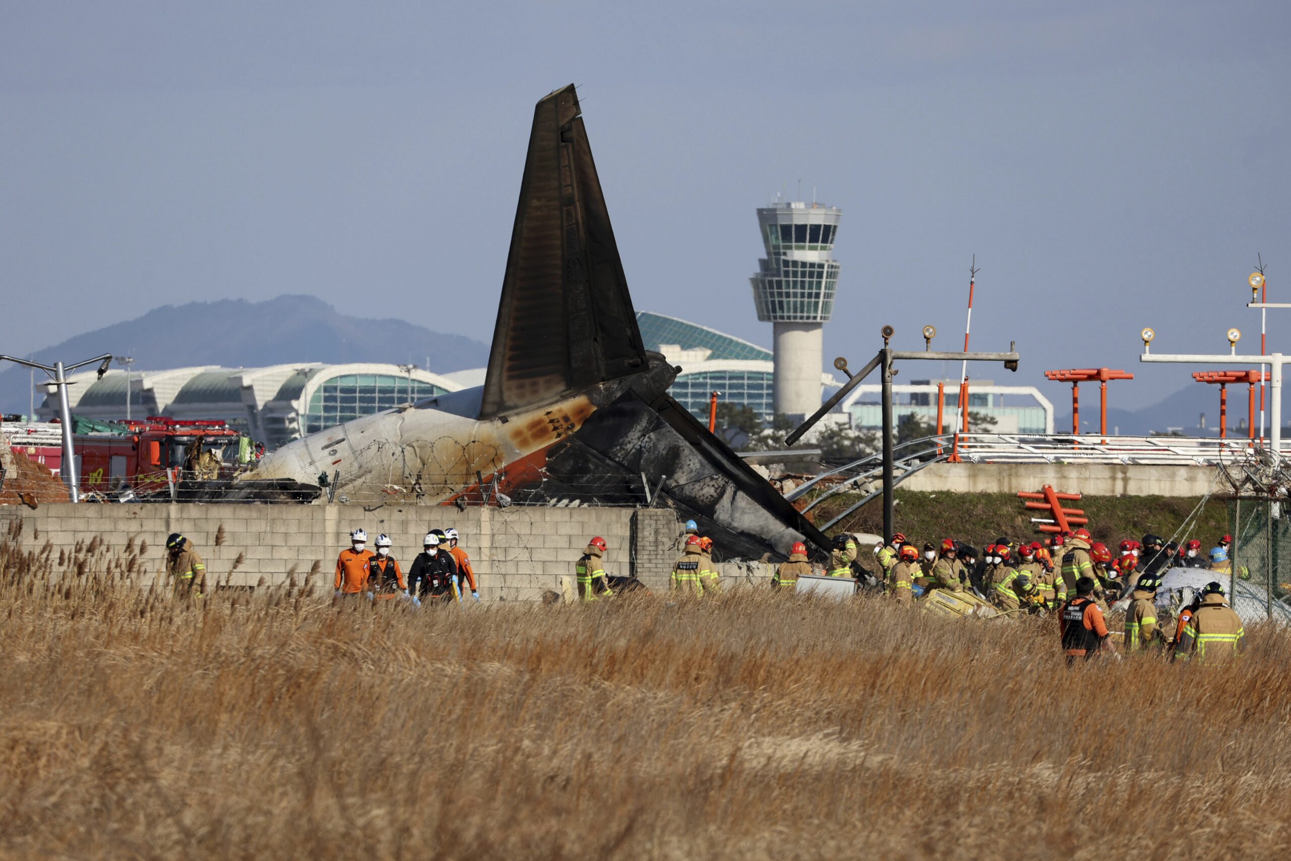 Plane bursts into flames after skidding off runway at airport in South Korea, killing 62 people