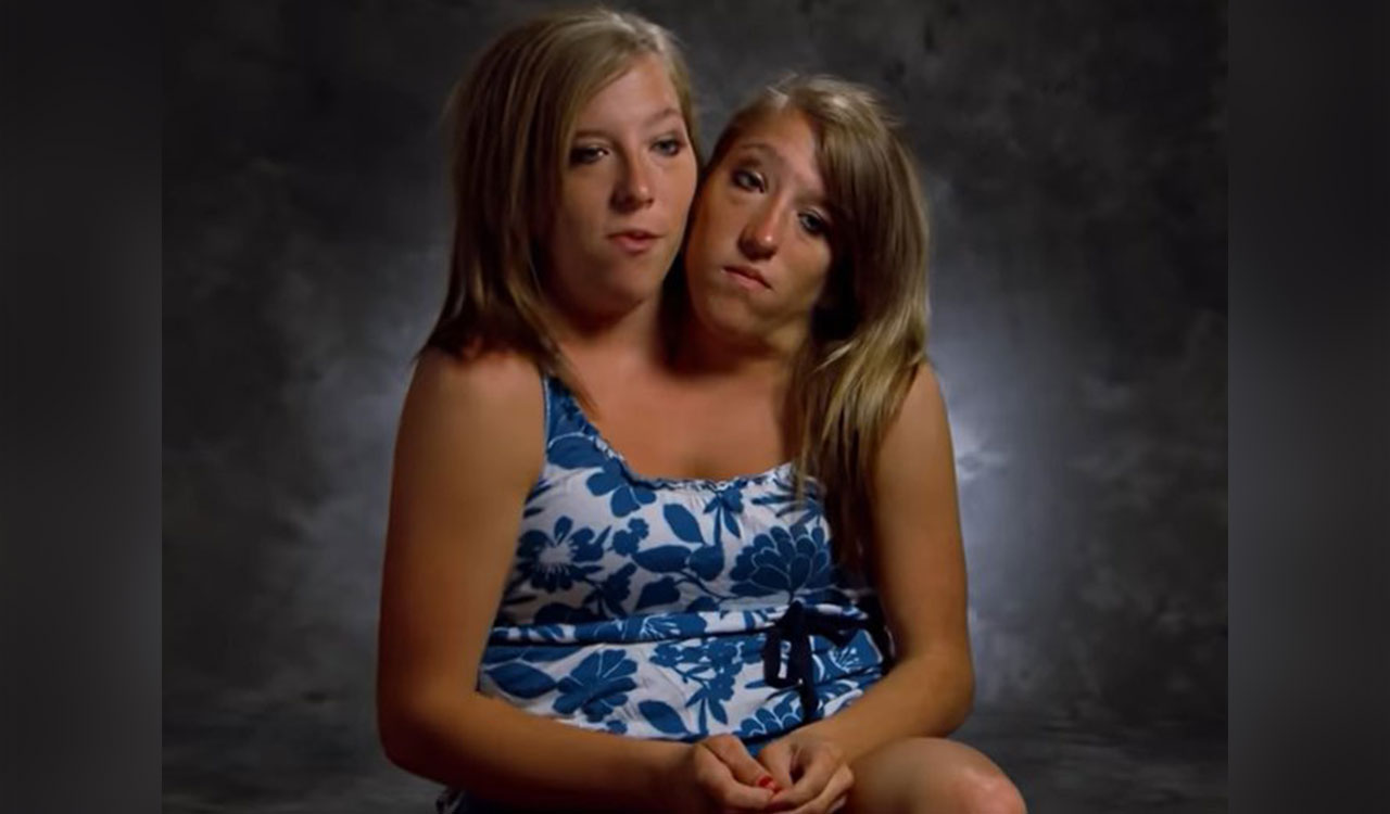 How two fully grown adults with independent minds share a single body?