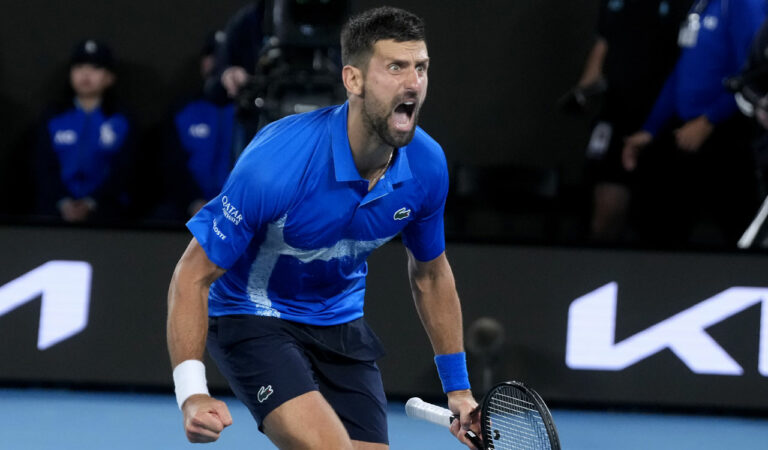 Novak Djokovic of Serbia celebrates after defeating Carlos Alcaraz of Spain in their quarterfinal match at the Australian Open in Melbourne, on Wednesday. Photo: AP