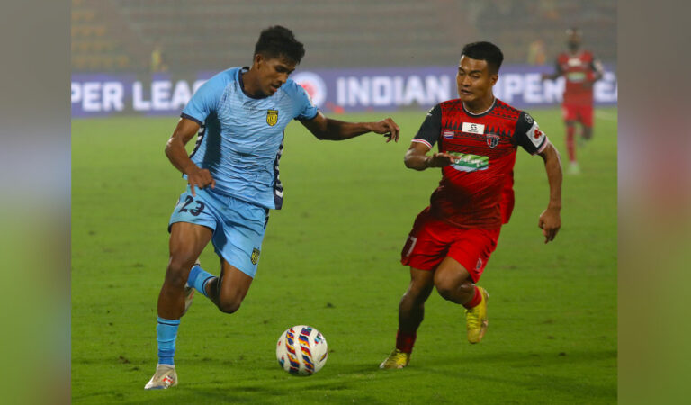 Hyderabad FC's Joseph Sunny (left) in action against NorthEast United FC at the Indira Gandhi Athletic Stadium, Guwahati on Wednesday.
