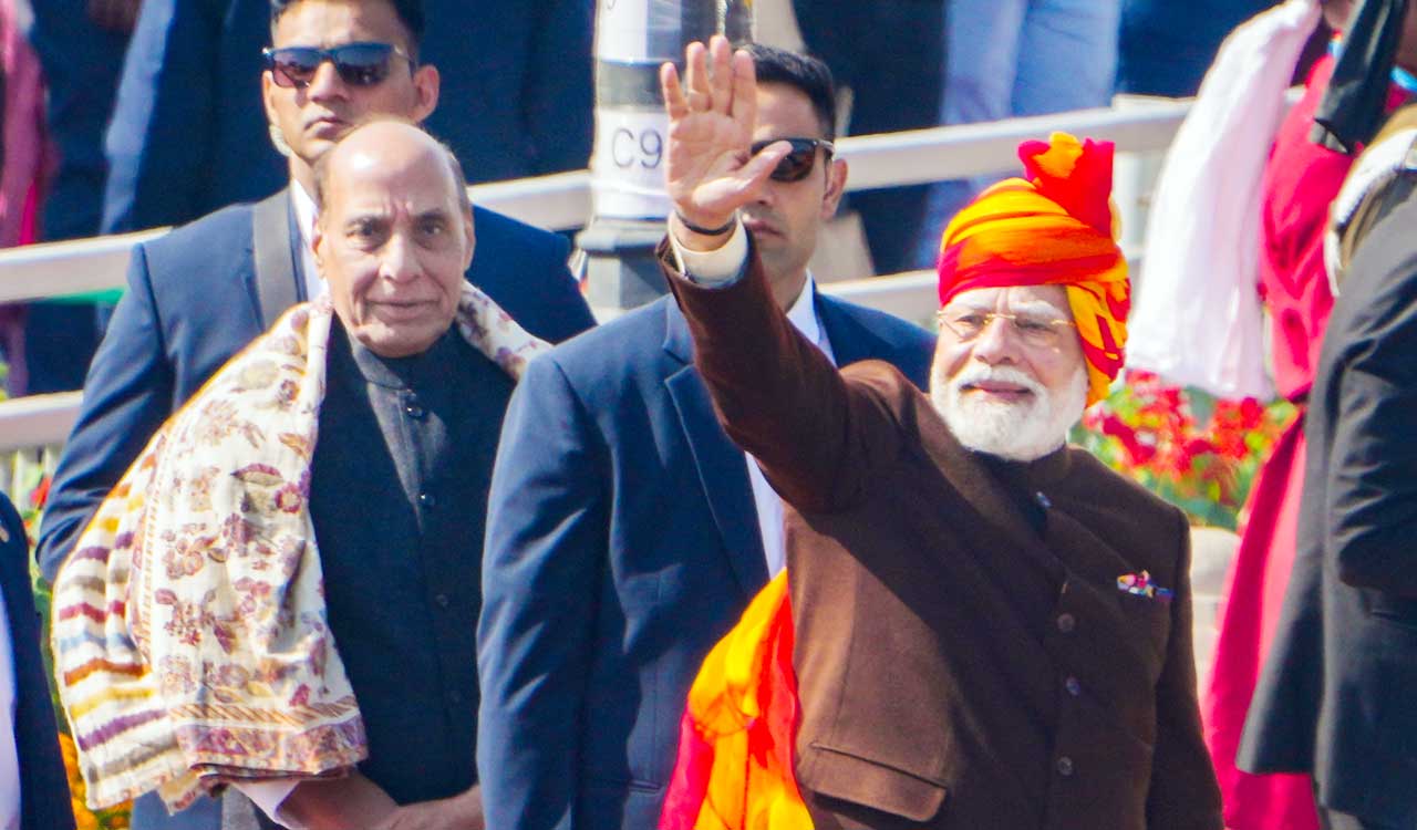 Prime Minister Narendra Modi walks down Kartavya Path to greet people